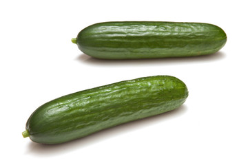 Mini Cucumbers isolated on a white studio background.