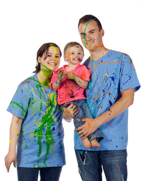Family smiling after having a paint fight