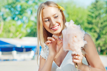 Girl eating cotton candy