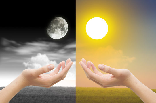 Hand With Day And Night Concept