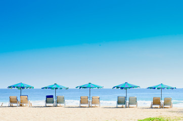 Beach chairs and with umbrella on the beach