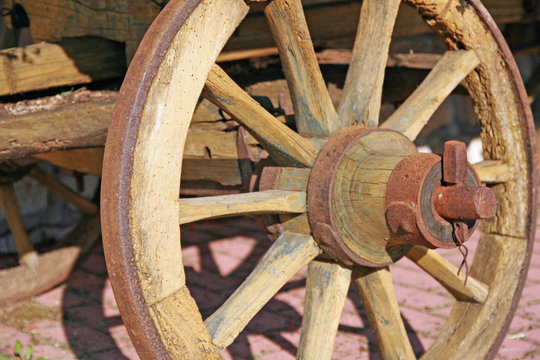 wheel of an old wooden cart for transporting things