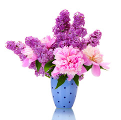 beautiful spring flowers in cup isolated on white