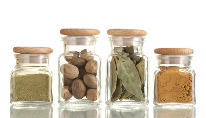 powder spices in glass jars  isolated on white