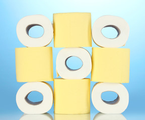 rolls of toilet paper on blue background