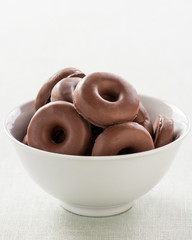 small donut topped with chocolate