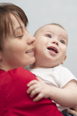 portrait of young mother and her son smiling together