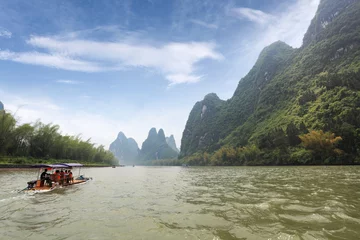 Keuken foto achterwand Guilin bamboo raft and  karst mountain landscape