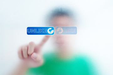 finger pressing Social Network icon on like button