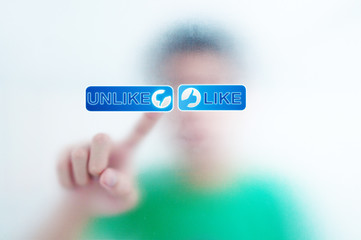 finger pressing Social Network icon on like button