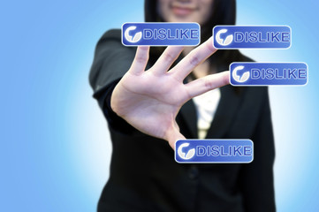 Business woman with hand touching DISLIKE button on touch screen