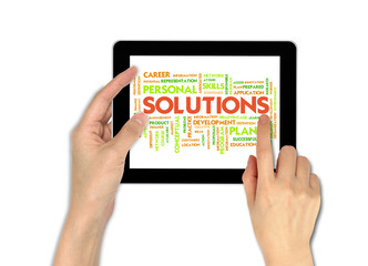 a male hand holding a touchscreen computer