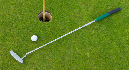 Golf hole with ball and putt