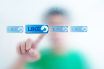 man pressing a touchscreen like button