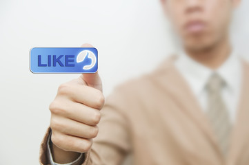 Business man pressing a touchscreen like button