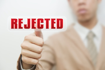 Business man pressing touch screen oncancelled button