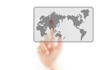 man finger pressing a worldmap touchscreen button with index fin