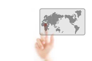 man finger pressing a worldmap touchscreen button with index fin