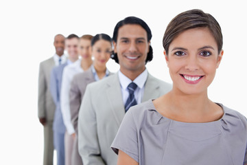 Big close-up of colleagues in a single line smiling and looking
