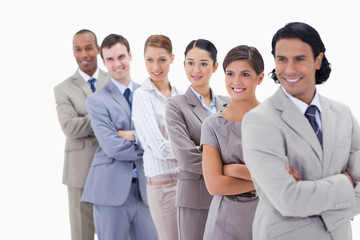 Close-up of a business team smiling in a single line looking tow