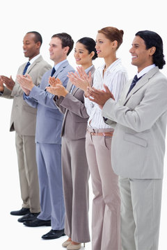 Business people smiling and applauding