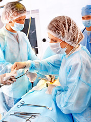 Surgeon at work in operating room.