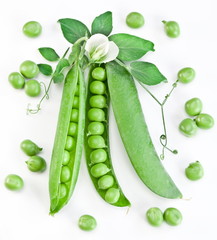 Pods of green peas with leaves