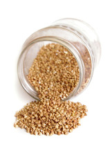 Buckwheat in jar, isolated on white