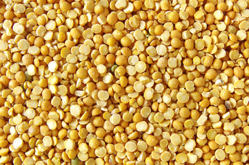 Dry split yellow peas texture background