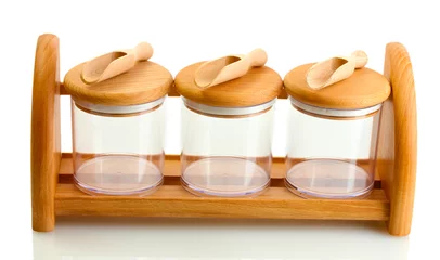 Foto auf Glas empty glass jars for spices with spoons © Africa Studio