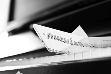 The piano and paper toy-ship