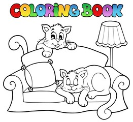 Canapé de livre de coloriage avec deux chats