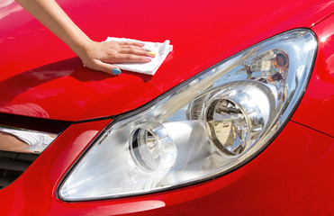 Young girl polishing car