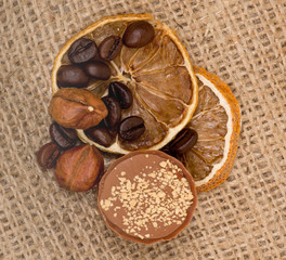 Sweet, lemon, nuts and coffee beans on burlap