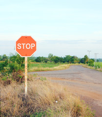 stop sign in a country road