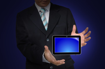 Hand of business Man holding Touch screen tablet PC