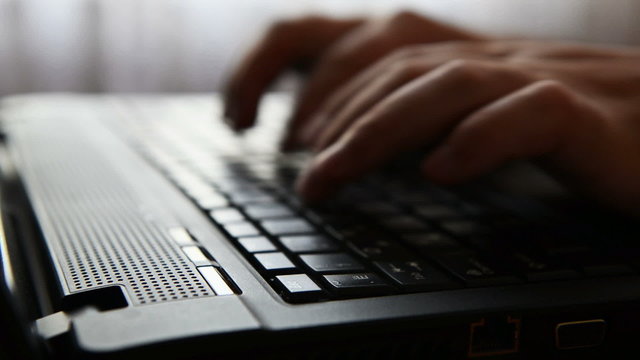 typing on a laptop keyboard