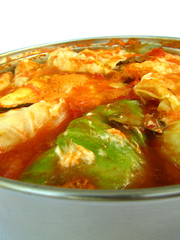 Cabbage rolls from the side on white background