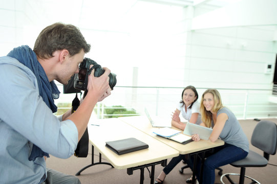 Photographer taking pictures of models