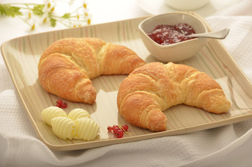 Croissants with butter and jam