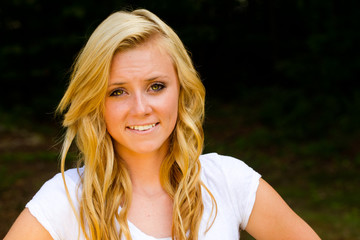 Summer portrait of happy smiling pretty teenage girl outdoors 