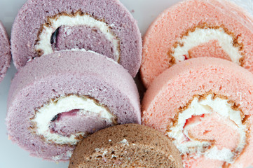 swiss roll -strawberry , taro and chocolate