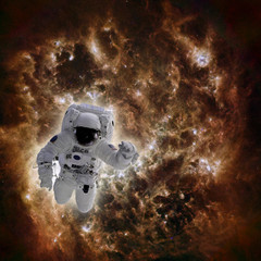 Astronaut in space with galaxy in background