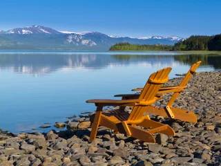  Wooden deckchairs overlooking scenic Lake Laberge © PiLensPhoto