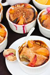 Muffins with raspberry filling and peach slices