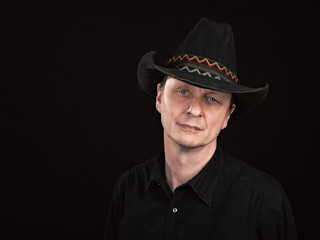 Naklejka premium Portrait of a man with cowboy's hat