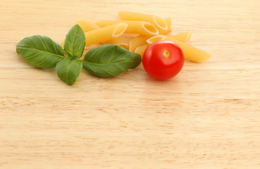 Basil pasta tomato on wood