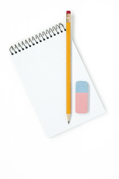 Pencil with eraser and notebook on white background