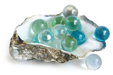 Big glass balls in shell of oyster