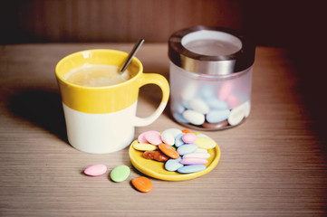 Cup of coffee with cookies on a table